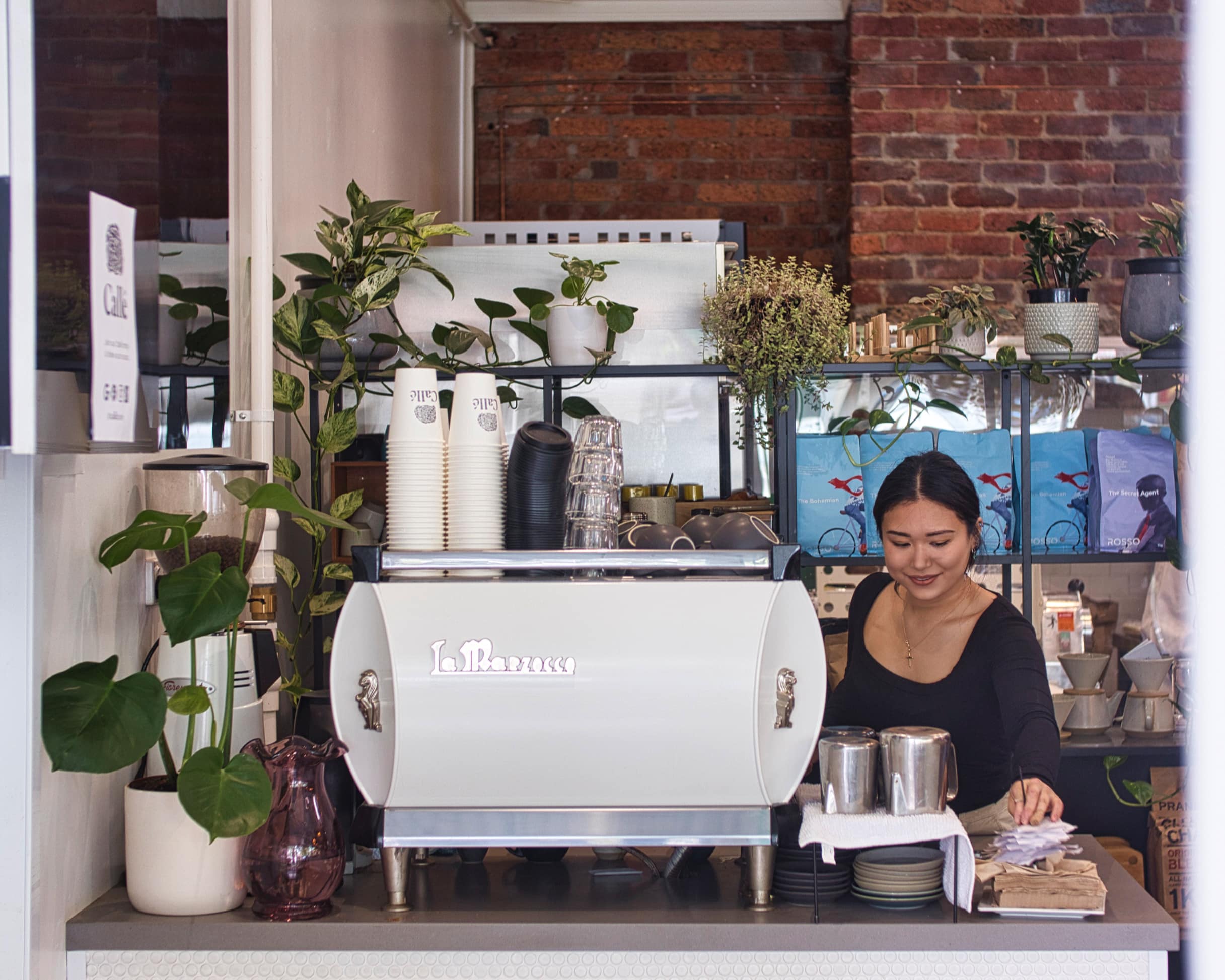 A woman working at a cafe